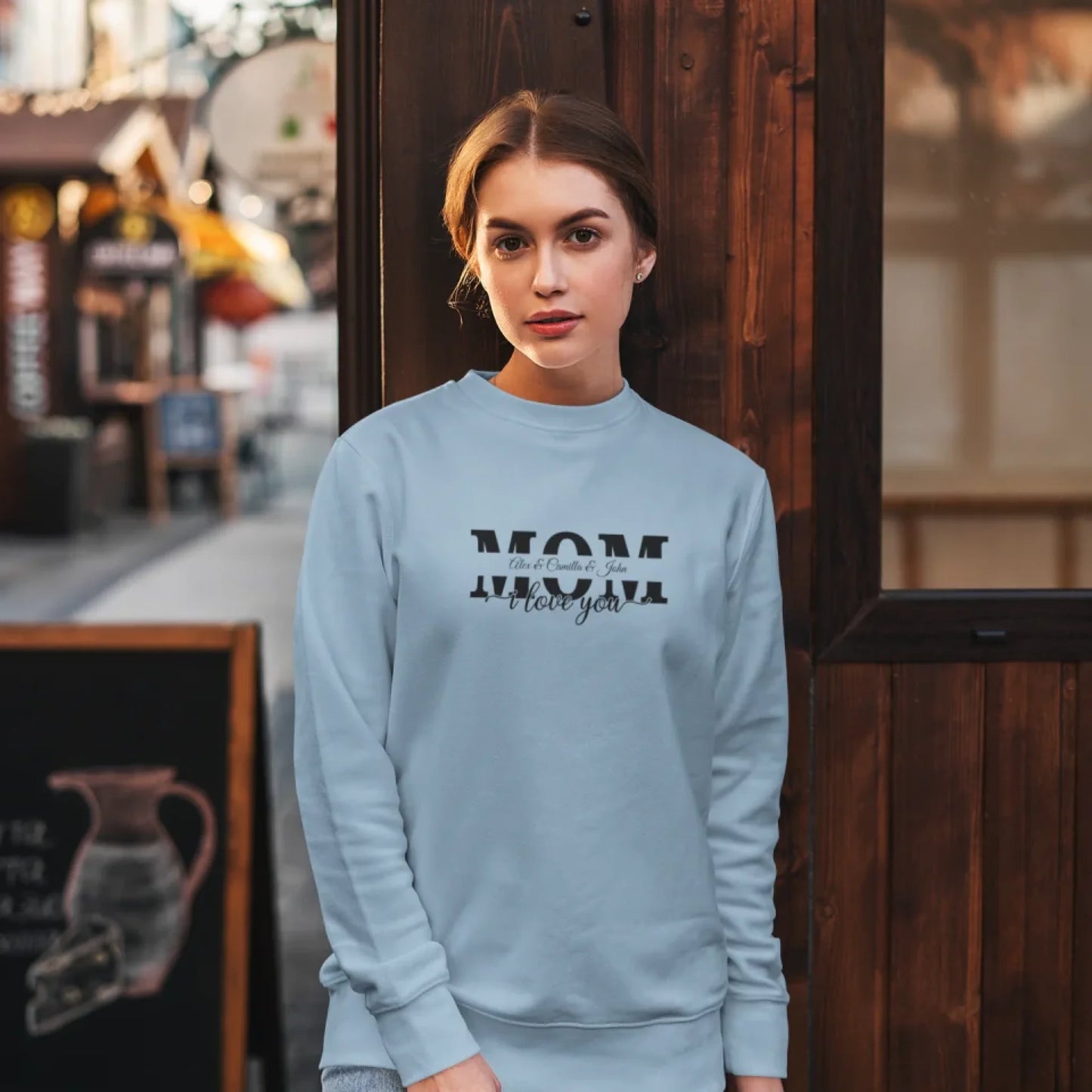 sweatshirt-mockup-featuring-a-woman-posing-against-a-wooden-wall-5293-el1