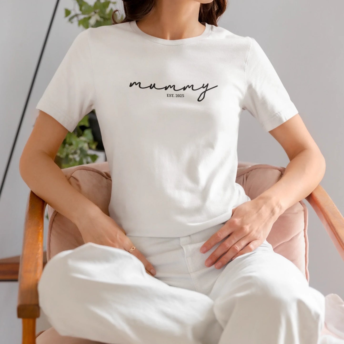 mockup-of-a-woman-wearing-a-bella-canvas-t-shirt-on-a-chair-m37309 (4)